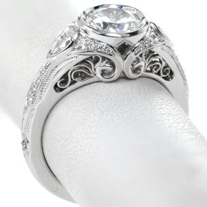 Antique engagement ring in Atlanta with filigree, milgrain and bezel set round center.