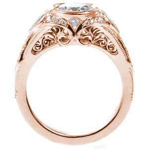 Antique inspired custom engagement ring with pear cut side diamond and profile filigree pockets in Madison.