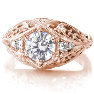 Wide band engagement rings in Hastings with round brilliant center stone and custom filigree.