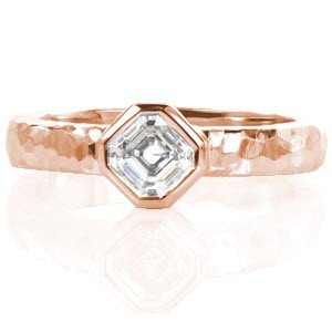 A striking example of modern simplicity, Design 3245 is an engagement ring fitting any style.  The 14 karat band of white gold displays a one of a kind hand hammered band, each ring will have a unique finish. The 0.50 carat asscher cut diamond is strategically placed kite set, with a pristine full bezel.
