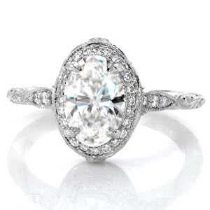 Charlotte oval engagement ring with diamond halo, milgrain edges and hand engraving.