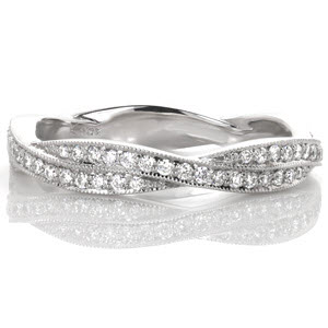 Winnipeg unique wedding bands with infinity twist pattern. This woven wedding band features micro pave diamond bands twisted together for a stunning look.