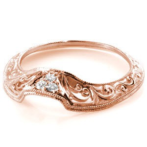 Design 3270 is a magnificent representation of hand craftsmanship at its best. The 14k white gold contour band is presented in knife edge form, allowing the slimmest profile. Adornments include round bead set diamonds on the basket, hand formed filigree curls and relief engraving.