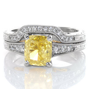 This delicate wedding band is the perfect match for Design 3275. The band is elegantly detailed with micro pavé diamonds, hand engraving on both outside surfaces, and hand forged yellow gold filigree curls. The width of the band matches engagement ring and contours around the flare of the center stone.  