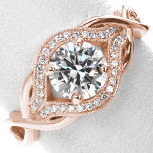 Rose gold engagement ring in Colorado Springs with round brilliant center stone, micro pave diamonds and woven bands.
