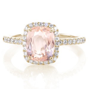 Henderson custom halo engagement ring with a micro pave rose gold diamond band with a unique cushion cut morganite center stone.