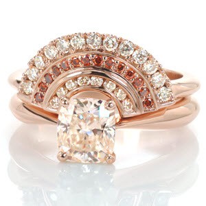 Design 3300 captivates the eye and adds the perfect Art Deco inspired detail to your solitaire engagement ring.  A trio of layers creates an arrangement of top light brown diamonds and irradiated red diamonds which are bead and channel set within the warm hue of 14k rose gold.