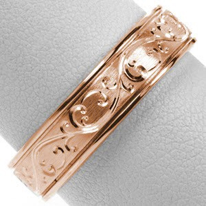 Rose gold wedding ring in Oakland with scroll engraving, brushed center and high polished edges.