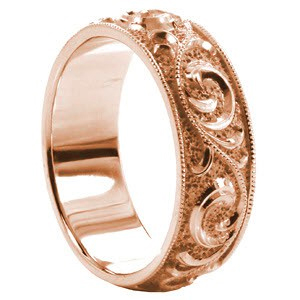 Wide band wedding ring with scroll filigree and milgrain border in rose gold.