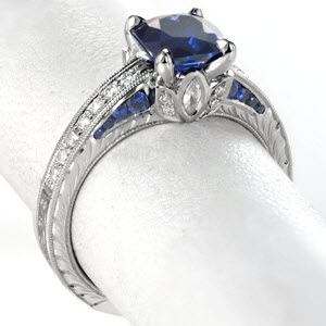 Antique sapphire engagement ring features diamond and sapphire side stones in Chicago. The stunning hand engraved patterns complete this hand crafted look. 
