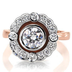Rose gold halo engagement ring in Salt Lake City features a two-tone design with a rose gold band and basket. The diamond settings are in platinum, and have a very vintage appeal.