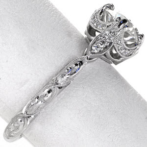 Hand engraved engagement ring in Boston with round center stone, milgrain and diamonds.