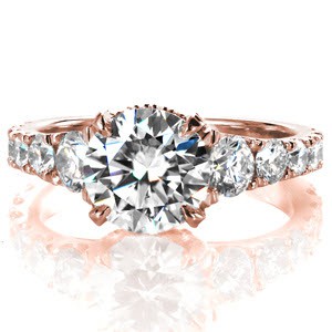 Crafted in 14k white gold and shown with a 2.00 carat round center diamond, Design 3352 elegantly combines a bold look with classic styling.  Hand formed U-Cut prongs capture individually set, graduated side diamonds creating a stunning profile.  Fine details of micro pave prongs and basket add the perfect finish.