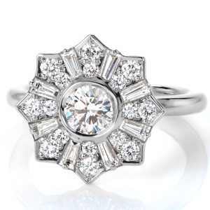 Antique inspired custom engagement ring in Henderson with a unique star burst halo surrounding a round center diamond.