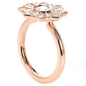 Rose gold custom engagement ring in Miami with a unique star burst halo surrounding a round center diamond.