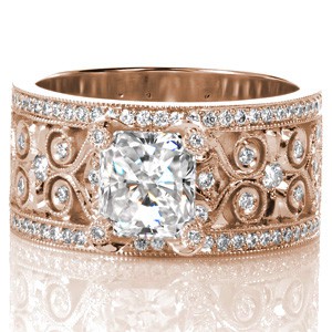 Rose gold custom engagement ring in Grand Rapids with a unique wide diamond patterned band holding an emerald cut diamond center stone.