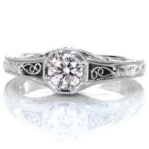 Antique inspired custom engagement ring with a round brilliant diamond held in a unique octagon setting surrounded by milgrain and filigree in West Valley City.