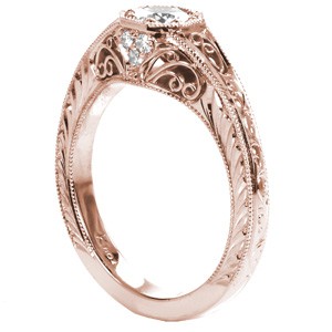 Rose gold custom engagement ring in Grand Rapids with a round diamond held in a unique octagon setting with hand formed filigree and engraving.