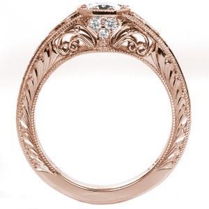 Rose gold custom engagement ring in Des Moines with a round diamond held in a unique octagon setting with hand formed filigree and engraving.
