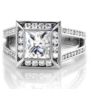 Design 3378 is a beautiful contemporary engagement ring setting. Featuring a 1.50 carat princess cut center diamond in a bezel setting, the ring has a halo and a split shank band. The diamonds on the halo and band are in channel settings which compliment the bezel of the center stone.