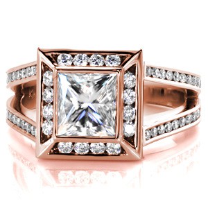Design 3378 is a beautiful contemporary engagement ring setting. Featuring a 1.50 carat princess cut center diamond in a bezel setting, the ring has a halo and a split shank band. The diamonds on the halo and band are in channel settings which compliment the bezel of the center stone.