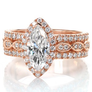 San Bernardo custom created halo engagement ring with a marquise shaped center diamond atop a wide three row diamond band.
