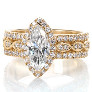 Columbia custom created halo engagement ring with a marquise shaped center diamond atop a wide three row diamond band.