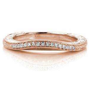 This delicate wedding band was designed to wear against our Design 3248. The band slightly contours to follow the shape of the engagement ring for a perfect fit. Bead set diamonds and floral engraving runs the length of the band top view, with scroll relief engraving and filigree shown on its profile.