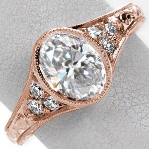 Antique engagement ring in Jacksonville with oval center stone, hand engraving and full milgrain bezel.