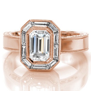 Vintage inspired custom rose gold engagement ring in Tucson with a unique baguette diamond halo surrounding an emerald cut diamond center.