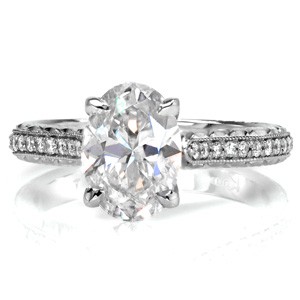 Hastings engagement ring with oval center stone, hand engraving and micro pave diamonds.