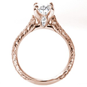 Rose gold custom engagement ring in San Diego with a hand engraved band, marquise surprise stone and oval center diamond.