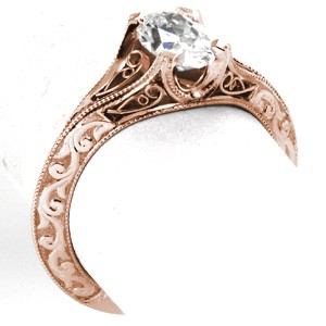 Unique rose gold engagement ring in Virginia Beach features hand formed filigree curls and hand carved relief style engraving. This antique rose gold engagement ring style has a unique knife edge band.