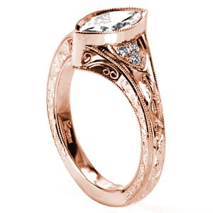 Antique rose gold engagement rings in Denver. This stunning ring is currently shown with a marquise cut center diamond in a bezel setting. The band is detailed with the finest hand engraving patterns, hand formed filigree curls, and micro pave diamonds.