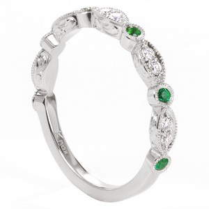 Indianapolis unique wedding bands with antique hand engraved patterns. This beautiful scalloped wedding band features alternating emeralds and diamonds on the top, with intricate hand engraved scroll patterns on the sides.