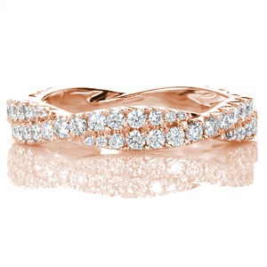 Unique braided rose gold wedding band in Atlanta. This gorgeous diamond and rose gold band features a woven design with graduating diamond sizes.