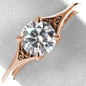 Rose gold engagement ring in Colorado Springs with round brilliant center stone and hand-formed filigree.