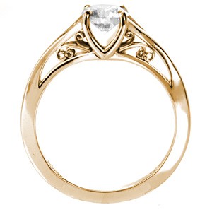 Vintage inspired custom engagement ring featuring a round brilliant center diamond held in a unique filigree setting in El Paso.