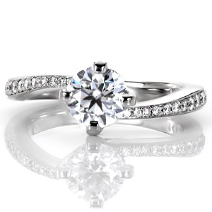 Design 3402 is a contemporary twist on an elegant, classic engagement ring style. The bead set diamond band tapers as it flows and transforms into the prongs of the center stone setting. The dazzling center stone is secured in a four prong setting with the prongs in a kite-set pattern. 