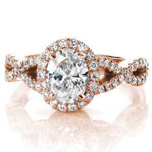 Oval halo rose gold engagement ring in Fort Worth with an infinity twist band and hand formed filigree curls.