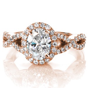 Halo engagement ring in Providence with oval center stone and woven band.