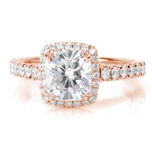 Design 3425 is an elegant combination of a classic halo outline paired with a unique filigree cathedral. A prong set 1.50 carat cushion cut diamond rest at its center with a regal appeal. Bezel set marquise shaped surprise stones add the finishing touch to this extraordinary ring design.