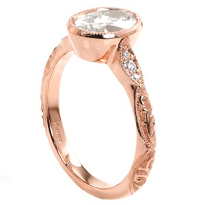 Rose gold engagement ring in Cleveland with oval center stone, full milgrain bezel and relief engraving. 