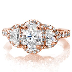 Fargo rose gold engagement ring with oval center stone, half-moon side stones and diamond halos.