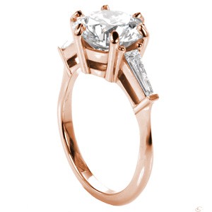 Custom rose gold contemporary engagement ring in McAllen with a round center stone and tapering baquette side diamonds.