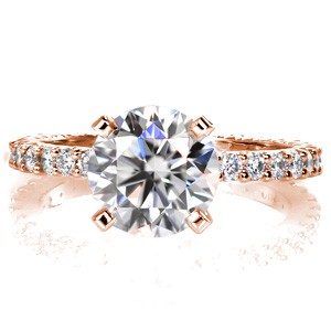 Eternidad Petite is an elegant design for classic tastes. The graceful band features brilliant cut round diamonds in shared prong settings. These dazzling gems encompass the entire circumference of the band, and highlight the featured 1.50 carat round brilliant center diamond.