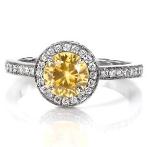 Custom sapphire engagement rings in Portland. This beautiful yellow sapphire is surrounded by a two-sided micro pave diamond halo, and a micro pave band.