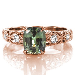 Custom engagement ring in Henderson with cushion cut green sapphire in a rose gold setting.