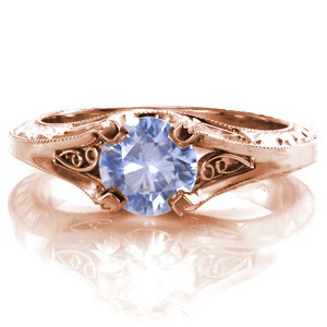 Antique engagement ring in Henderson with filigree, hand engraving and blue sapphire center stone.