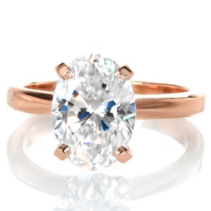 Our Oval Classic Solitaire may be your perfect setting if you wish to give prominence to your hand selected oval cut center diamond. Your beautiful elongated center stone will be accented by an elegant four prong setting and a slim, rounded, high polished band.